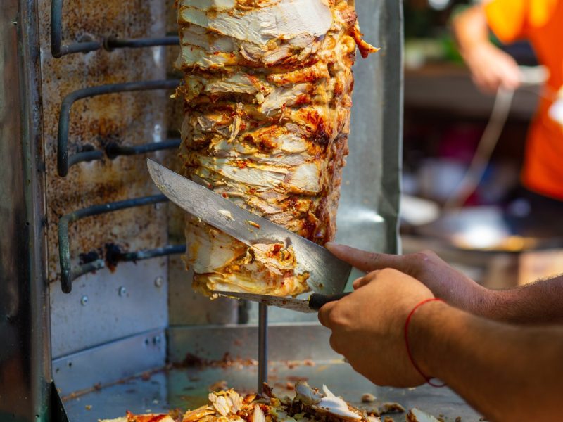 Chef,Cutting,With,Doner,Knife,Traditional,Turkish,Doner,Kebab,Meat.